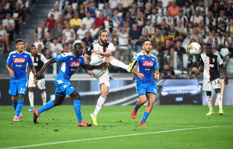 Gonzalo Higuain scores Juventus' second goal. Reuters