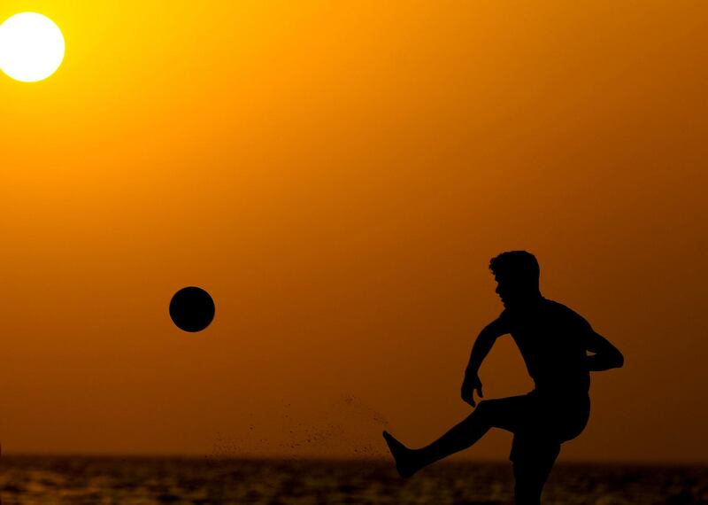 Visitors to Kite beach play Footvolley at sunset in Dubai on June 8th, 2021. Chris Whiteoak / The National. 
Reporter: N/A for News