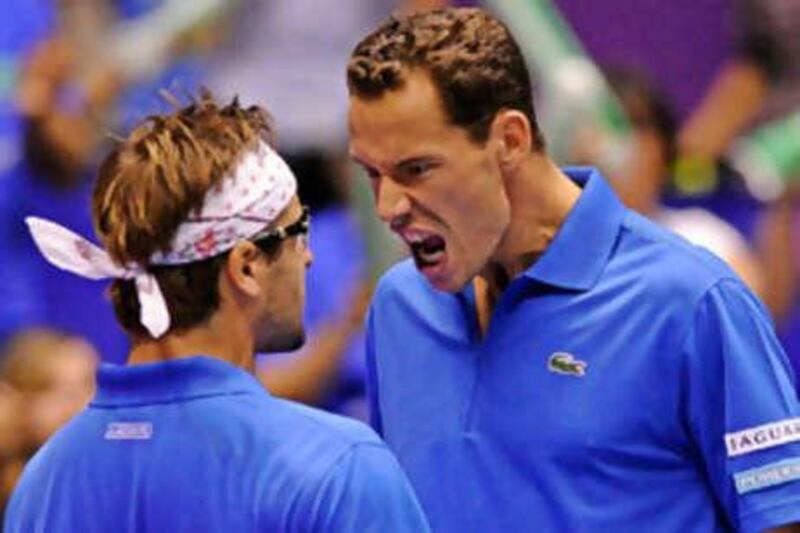 Michael Llodra and Arnaud Clement celebrate victory.