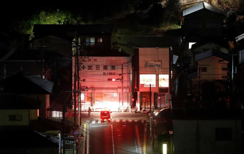 A firefighter vehicle patrols streets following a strong earthquake in Iwaki, Fukushima prefecture, Japan February 13, 2021. REUTERS