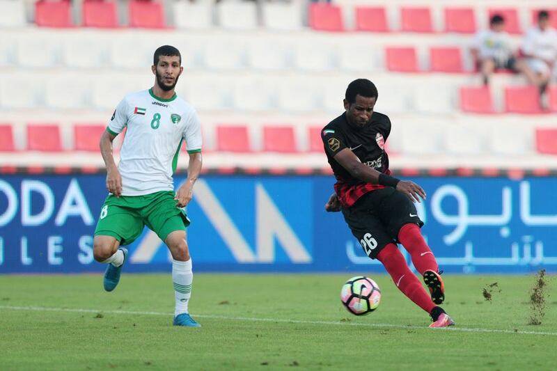 Al Ahli’s Abdulaziz Haikal, right, gets a shot on net against Emirates during their Arabian Gulf League match in Dubai on Saturday. Christopher Pike / The National