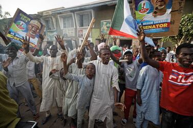 Supporters of President Muhammadu Buhari celebrate the announcement of results favoring his All Progressives Congress (APC) party in their state, anticipating victory, in Kano, northern Nigeria Monday, February 25, 2019. AP