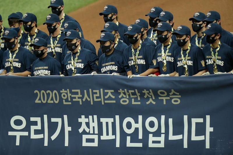 NC Dinos players pose after winning baseball's Korean Series Game Six on November 24, 2020 in Seoul, South Korea. South Korea's contact tracing was so sophisticated that tracers used bank card payments and CCTV to track down Covid carriers. Han Myung-Gu / Getty Images