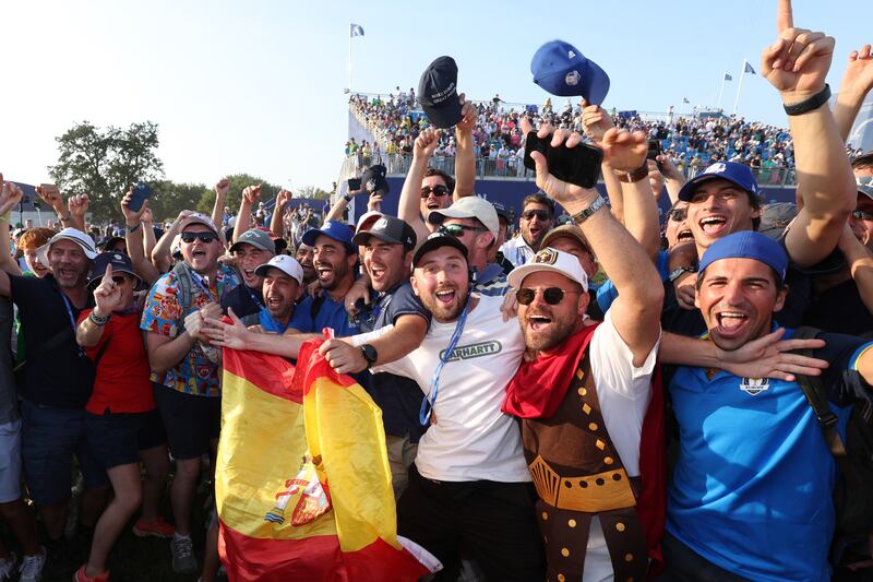 Team Europe fans show their support on the 18th green during the Sunday singles matches of the 2023 Ryder Cup. Getty