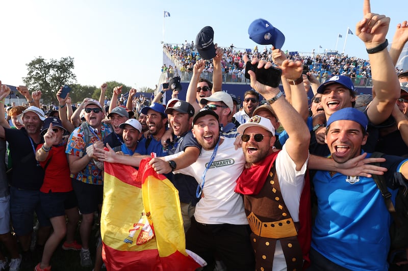 Team Europe fans show their support on the 18th green during the Sunday singles matches of the 2023 Ryder Cup. Getty