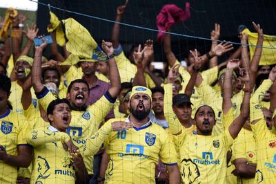 (FILES) This file photo taken on December 18, 2016 shows Kerala Blasters FC supporters cheering before the final Indian Super League (ISL) football match Between Kerala Blasters FC and Atletico de Kolkata at the Jawahar Lal Nehru Stadium in Kochi.
The Indian Super League has slashed the number of high-earning foreign stars for its new season starting Friday but foreign coaches, including ex-England heroes Teddy Sheringham and Steve Coppell, will be in charge of every team. / AFP PHOTO / SAJJAD HUSSAIN