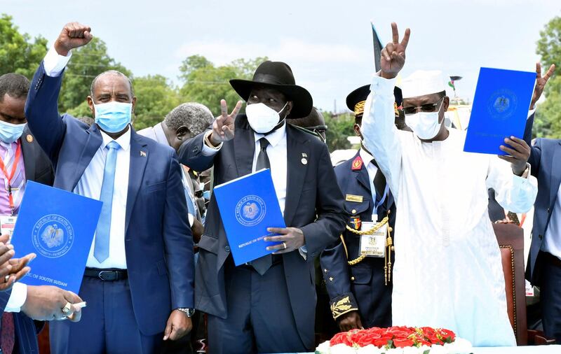 Sudan's Sovereign Council Chief General Abdel Fattah al-Burhan, South Sudan's President Salva Kiir, and Chad President Idriss Deby attend the signing of peace agreement.  Reuters