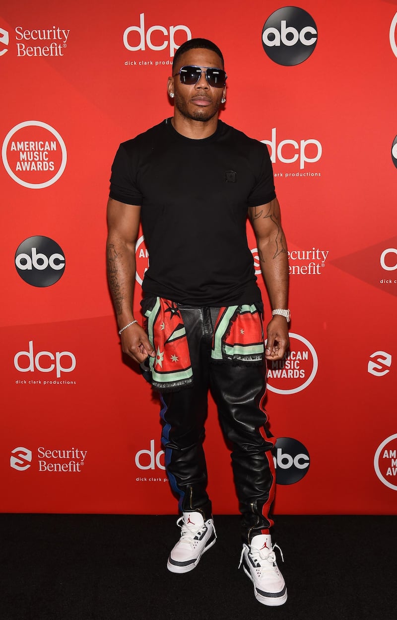 Nelly arrives at the American Music Awards at the Microsoft Theatre on November 22, 2020 in Los Angeles. AFP