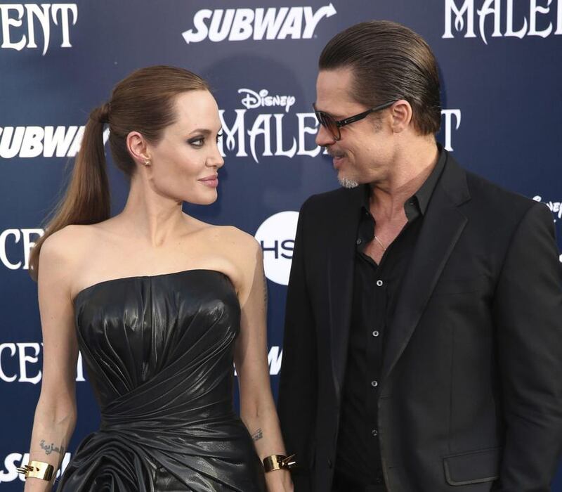 Angelina Jolie and Brad Pitt have reached an agreement to handle their divorce in a private forum and will work together to reunify their family, the actors announced in a joint statement. Matt Sayles / Invision / AP File