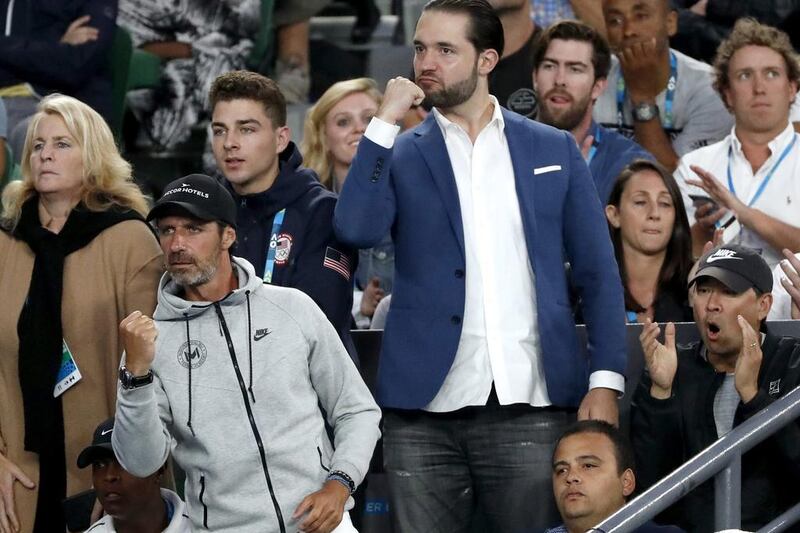 Alexis Ohanian, centre, fiance of Serena Williams cheers her on during the Australian Open final. Dita Alangkara / AP Photo