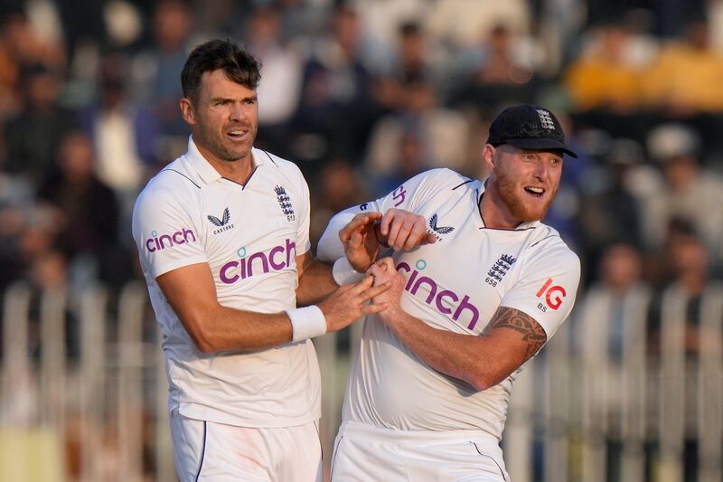 England's James Anderson and Ben Stokes celebrate after the dismissal of Pakistan batter Zahid Mahmood for one. AP