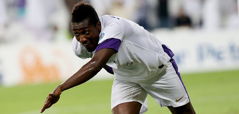 Al Ain, United Arab Emirates- March,18, 2014:  Asamoah Gyan of Al Ain (UAE)  celebratres after scoring  a goal against  Tractorsazi (Iran)  during the AFC Champions League at the Hazza Bin Zayed Stadium in Al Ain . ( Satish Kumar / The National )  For Sports