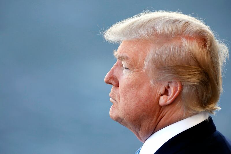 epa06086397 US President Donald J. Trump attends the traditional military parade as part of the Bastille Day celebrations in Paris, France, 14 July 2017. The Bastille Day, the French National Day, is held annually on 14 July to commemorate the storming of the Bastille fortress in 1789.  EPA/IAN LANGSDON