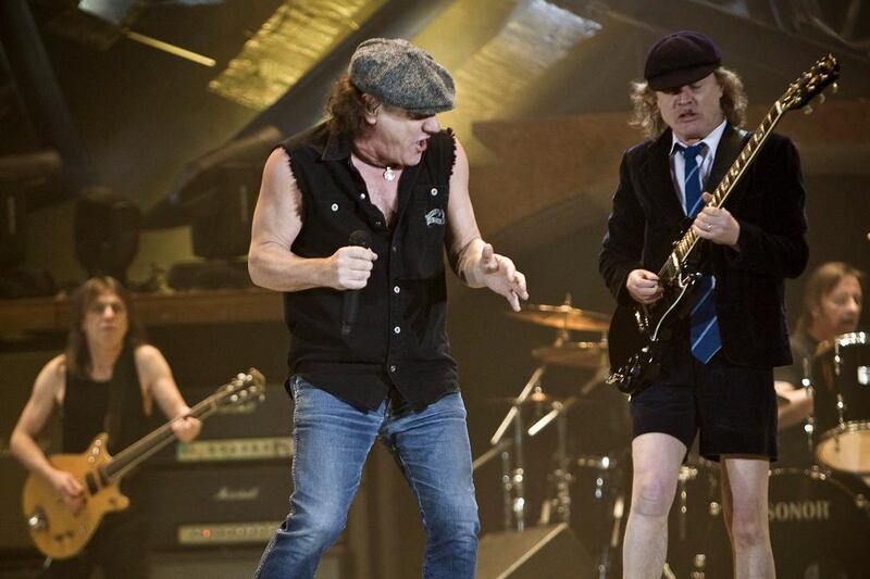 Brian Johnson, left, and Angus Young during a concert in Zurich. Ennio Leanza / EPA  