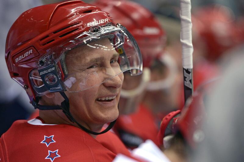 Putin smiles during an ice hockey match as part of the Night Hockey league tournament in Sochi on May 16, 2015. AFP