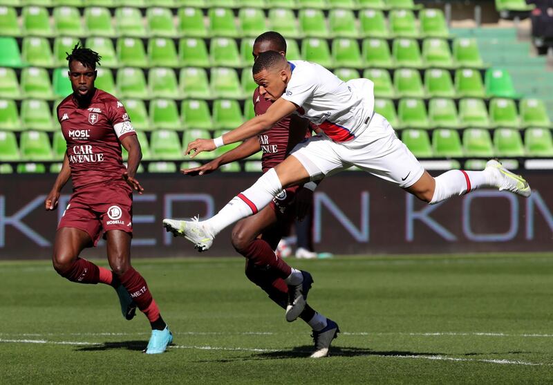 Paris Saint-Germain's Kylian Mbappe scores their first goal against Metz at the Stade Saint-Symphorien on Saturday, April 24. PSG won the game 3-1. Reuters