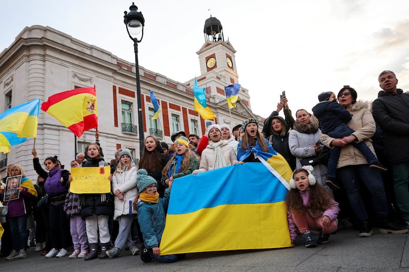 People attend a demonstration to mark the second anniversary of Russia's full-scale invasion of Ukraine, in Madrid, Spain. Reuters