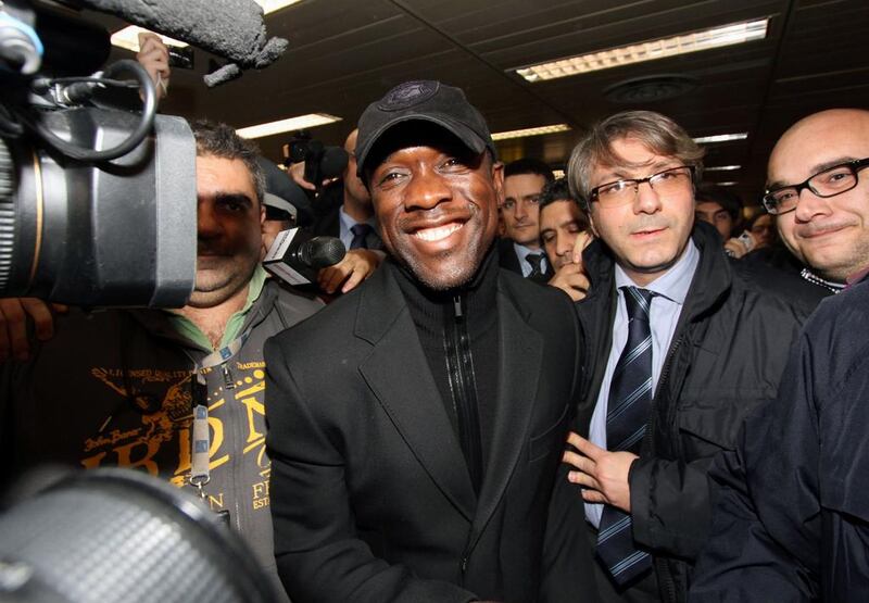 Clarence Seedorf, left, worked under just three coaches while an AC Milan player. Alberto Lingria / AFP