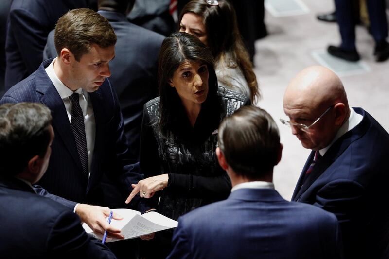 Russian Ambassador to the United Nations (UN) Vasily Nebenzya and U.S. Ambassador to the UN Nikki Haley speak before a meeting of the UN Security Council to vote on a bid to renew an international inquiry into chemical weapons attacks in Syria, at the UN headquarters in New York, U.S., November 16, 2017. REUTERS/Lucas Jackson