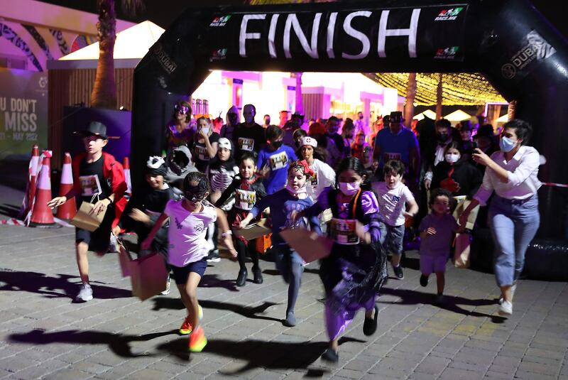 Children cross the finish line at the one-of-a-kind Halloween Run