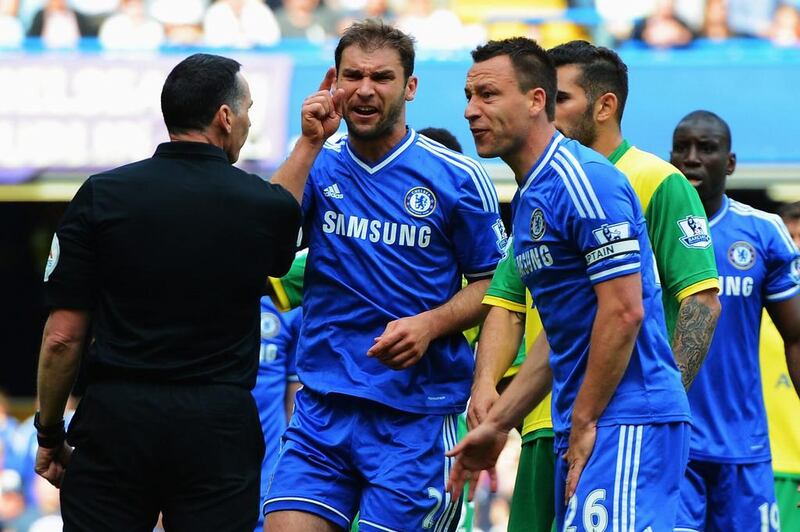 John Terry, right, and Branislav Ivanovic, centre, of Chelsea react as referee Neil Swarbrick turns down a penalty appeal during their Premier League match against Norwich City at Stamford Bridge on May 4, 2014 in London, England. Michael Regan / Getty Images