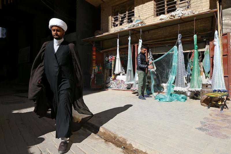A man walks past a shop selling fishing nets in Najaf. Reuters