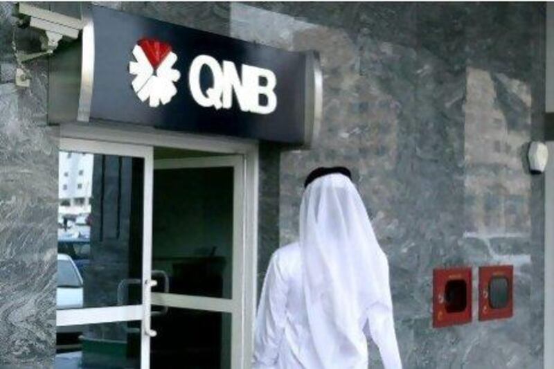 The 22.5 per cent stake Qatar National Bank bought at Commercial Bank International is equivalent to 329 million shares. Ryan Carter / The National