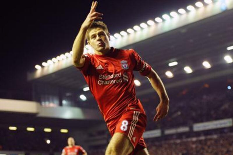 epa03143538 Liverpool's captain Steven Gerrard celebrates after scoring the 2-0 lead during the English Premier League soccer match between Liverpool FC and Everton FC at Anfield in Liverpool, Britain, 13 March 2012. Liverpool won 3-0 with all goals scored by Gerrard.  EPA/PETER POWELL DataCo terms and conditions apply. http//www.epa.eu/downloads/DataCo-TCs.pdf