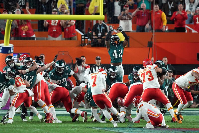 Kansas City Chiefs place kicker Harrison Butker (7) kicks a field goal to win the game against the Philadelphia Eagles in Super Bowl LVII at State Farm Stadium.  Reuters