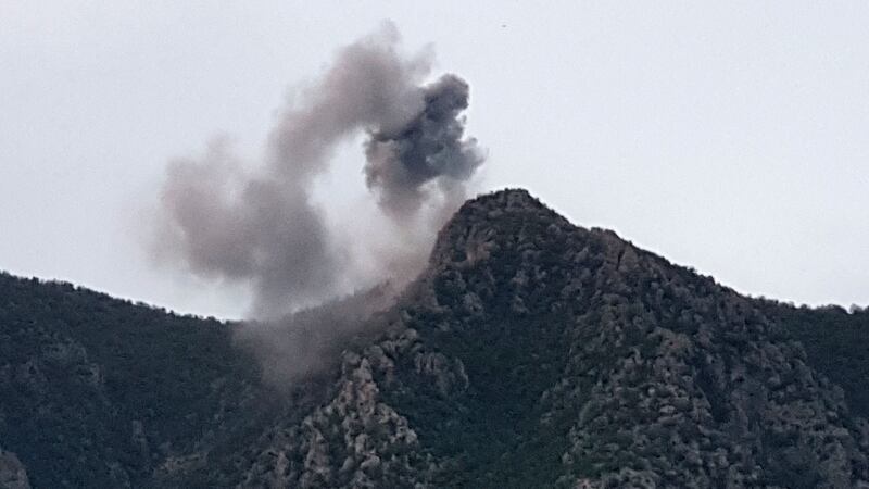 Smoke from a reported Turkish air raid on a site in the mountains near the village of Koherzi in the Amadiyah district north-east of Dohuk in the Kurdish autonomous region of Iraq. April 28, 2022. AFP
