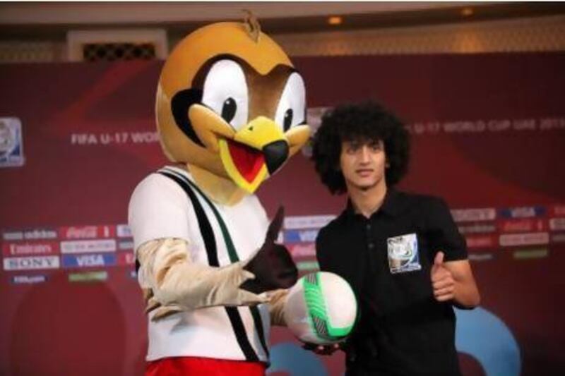 Al Ain playmaker Omar Abdulrahman with the Under 17 football World Cup mascot Shaqran at the Burj Al Arab in Dubai. Pawan Singh / The National