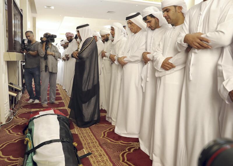 Sheikh Saud bin Saqr Al Qasimi, Ruler of Ras Al Khaimah, leads prayers over the body of First Lieutenant Pilot Jassem Saleh Al Zaabi on Saturday. Wam