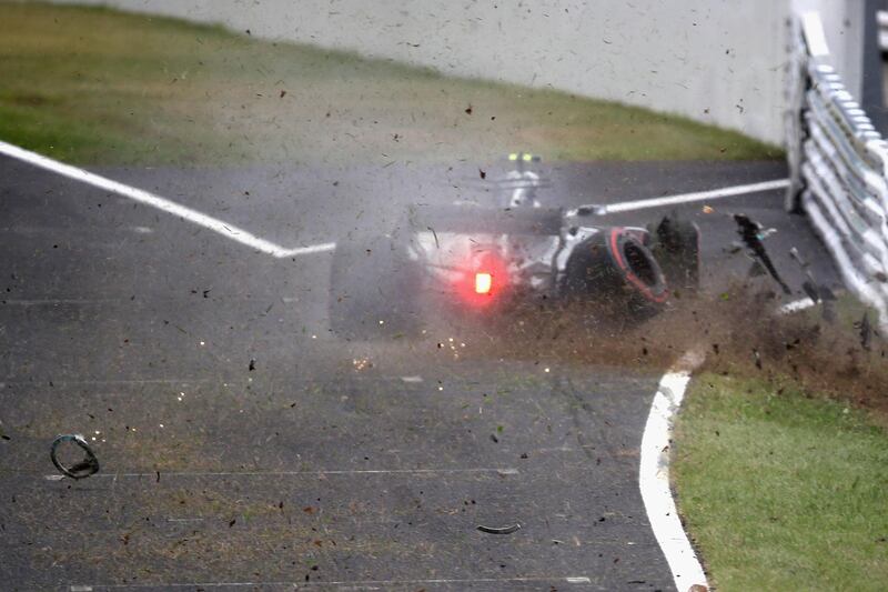 SUZUKA, JAPAN - OCTOBER 07:  Valtteri Bottas driving the (77) Mercedes AMG Petronas F1 Team Mercedes F1 WO8 crashes into a track barrier during final practice for the Formula One Grand Prix of Japan at Suzuka Circuit on October 7, 2017 in Suzuka.  (Photo by Clive Mason/Getty Images)