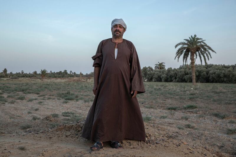 55-year-old Egyptian farmer Makhluf Abu Kassem stands on a land that was once fertile. AP