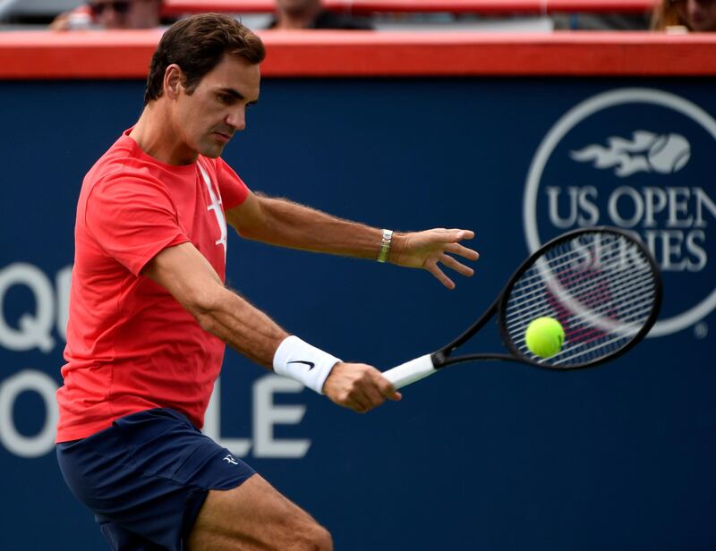 Aug 6, 2017; Montreal, Quebec, Canada; Roger Federer of Switzerland hits a backhand during a practice session at the Rogers Cup tennis tournament at Uniprix Stadium. Mandatory Credit: Eric Bolte-USA TODAY Sports