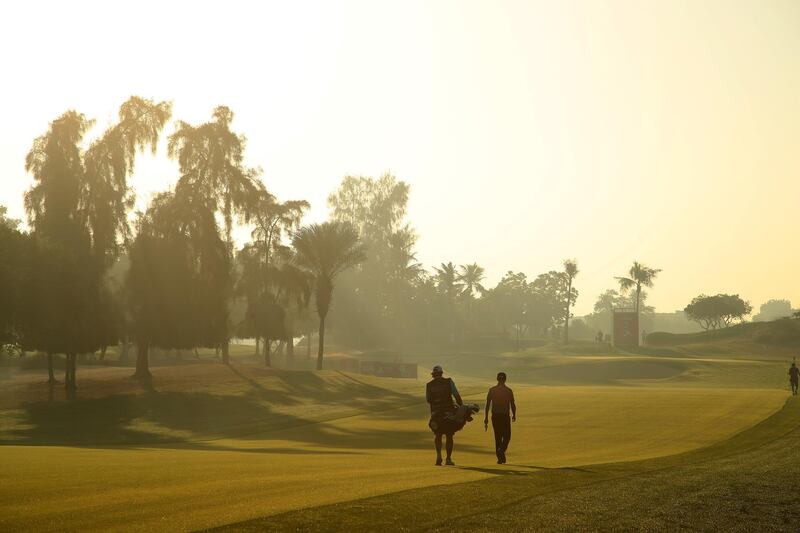 ]Justin Harding and his caddy on the third. The South African finished joint early leader in the clubhouse after carding a 66.  Getty