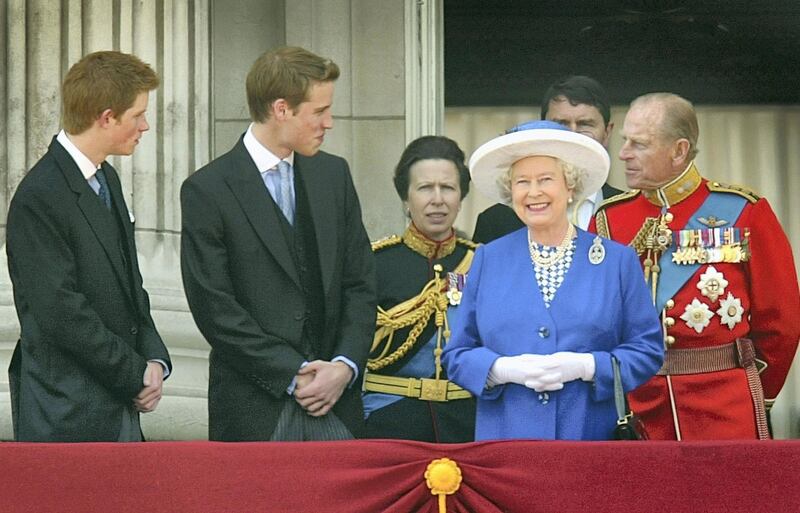 LONDON - JUNE 14:  Britain's Queen Elizabeth II (2R) smiles at the crowd from the balcony of Buckingham Palace as Prince Harry (L), Prince William (2L), Princess Anne (3L) and the Duke of Edinburgh (R) look on after attending the Trooping of the Colour ceremony June 14, 2003 in London, England. The ceremony marks the Queen's official birthday. (Photo by Scott Barbour/Getty Images)