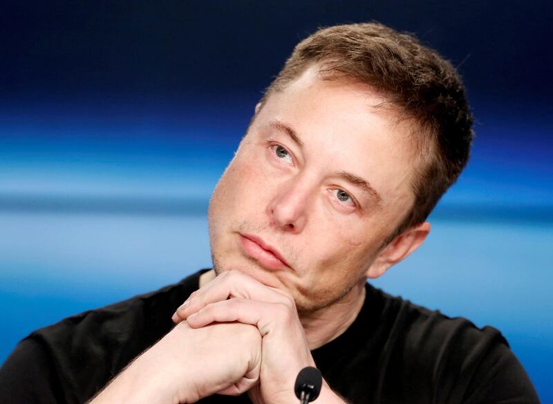 FILE PHOTO:   Elon Musk listens at a press conference following the first launch of a SpaceX Falcon Heavy rocket at the Kennedy Space Center in Cape Canaveral, Florida, U.S., February 6, 2018. REUTERS/Joe Skipper/File Photo