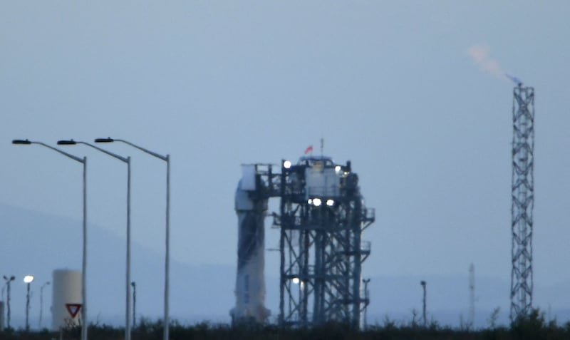 The New Shepard rocket sits at the launchpad. AFP