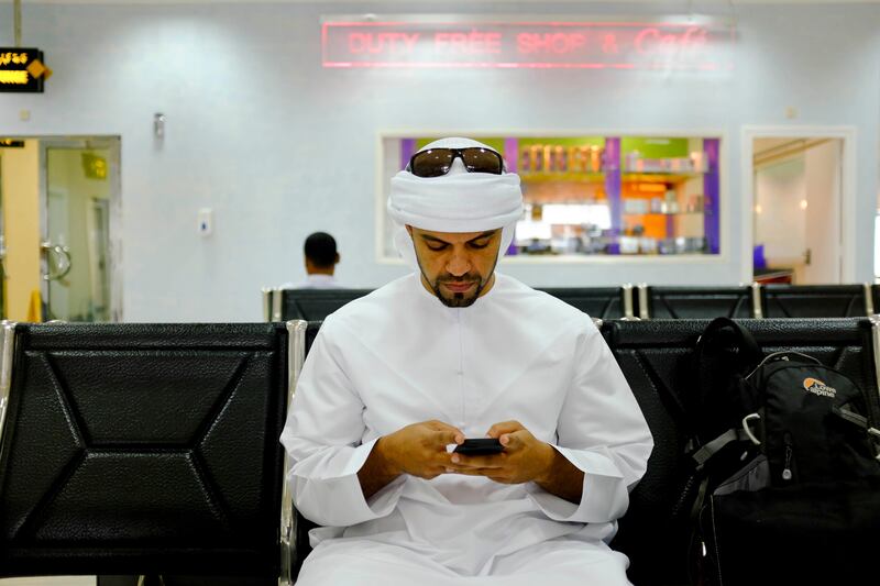 Abu Dhabi, United Arab Emirates - August 01 2013 - National reporter Thamer Al Subaihi waits at Al Bateen airport to check in to the morning flight launched by the new Rotana Jet that operates as a commuter flight daily between Abu Dhabi and Dubai. Four National reporters raced from Abu Dhabi to Dubai using various modes of transport to see which vehicle took the least time between two cities.  (Razan Alzayani / The National) 