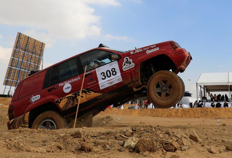Egyptians Khaled Azmy and Omar Azmy, of Jibal Rally team, compete in the O West Rally 2021. Reuters