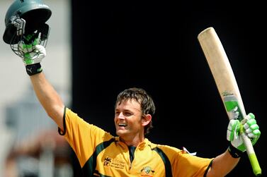 Australian cricketer Adam Gilchrist celebrates after completing his century during the final match of the ICC Cricket World Cup 2007 between Australia and Sri Lanka at the Kensington Oval in Bridgetown, 28 April 2007. Gilchrist made 149-runs before being dismissed as Australia scored 237-2 at the end of 33 overs as they bat first. AFP PHOTO/Jewel SAMAD (Photo by JEWEL SAMAD / AFP)