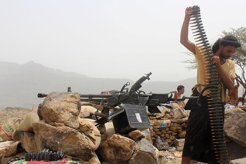 A Yemeni pro-government fighter reloads a heavy machine gun as coalition take over Houthi bases on the front line of Kirsh between the province of Taez and Lahj, southwestern Yemen. All photos by  Saleh Al Obeidi / AFP Photo