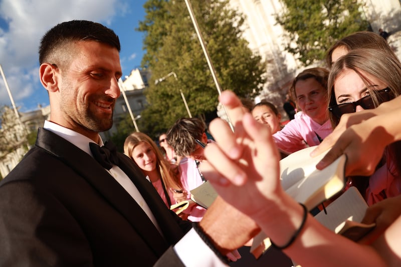 Novak Djokovic signs autographs as he attends the 2024 Laureus World Sports Awards in Madrid. Getty