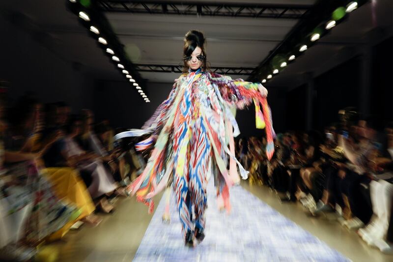 This colourful design and unusual headpiece is a creation by Libertine, showcased during New York Fashion Week. EPA