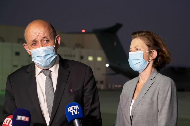 French Foreign Affairs Minister Jean-Yves Le Drian, left, and Armed Forces Minister Florence Parly talk to the press at Al Dhafra. AFP