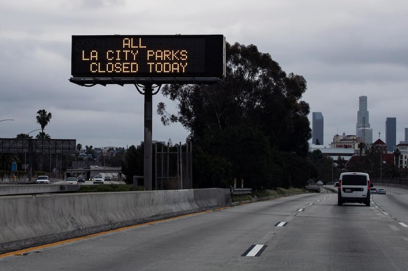 A traffic screen displays 'All LA City Parks Closed Today' amid the coronavirus pandemic in Los Angeles, California. EPA