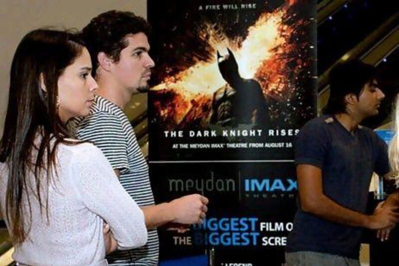 The release of a greater number of blockbusters this year such as The Dark Knight Rises will significantly boost admissions to the country's cinemas. Razan Alzayani / The National