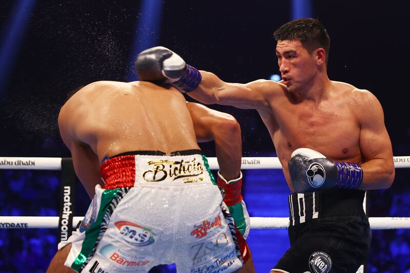 Dmitry Bivol throws a right at Gilberto Ramirez on his way to victory in their WBA light-heavyweight title contest at Etihad Arena on November 5, 2022 in Abu Dhabi. Getty