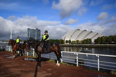Scottish police officers patrol near a Cop26 venue in Glasgow as preparations continue for the UN climate conference. AFP 